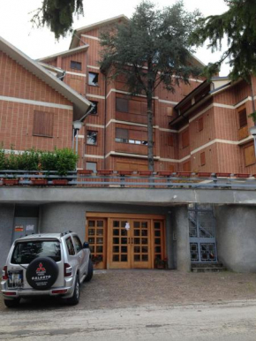 Отель Residence I Comignoli, Сканно